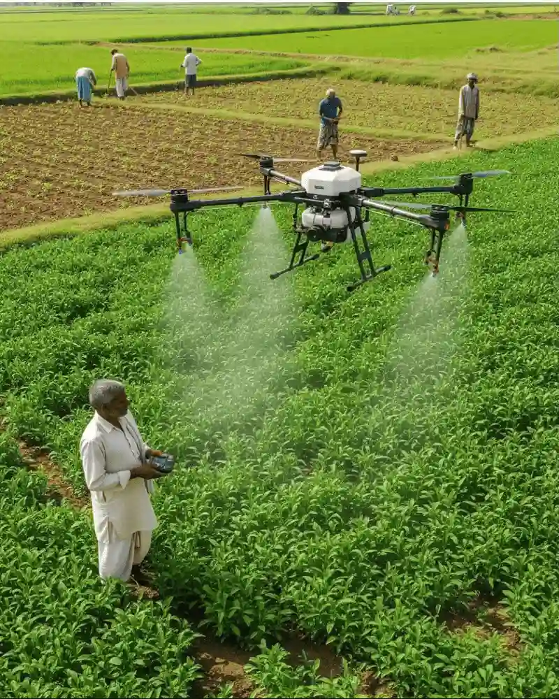 Agriculture drone spraying crops over an Indian farm field